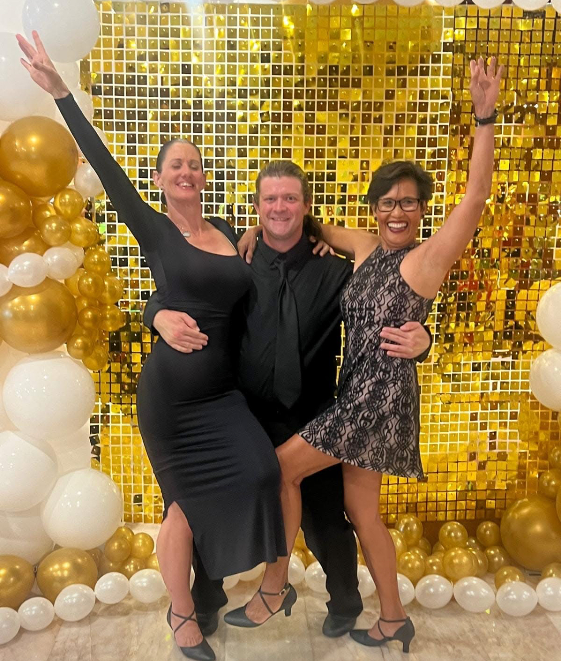 dance4Life FNQ celebration with gold backdrop and balloons